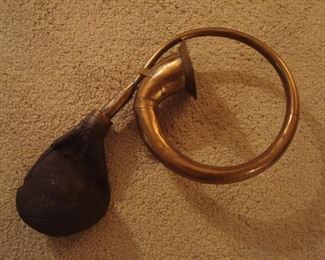 Lower Level:  A fun item:  an antique brass car horn.