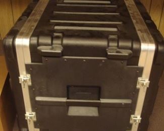 Lower Level:  A large hard case trunk.