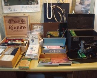 Lower Level:  A box of artist supplies/brushes, notions, are priced as lots but the vintage VOGUE patterns and sewing machine are separately priced.