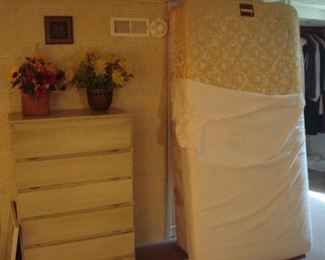 Lower Level:  A "shingle-front" vintage 5-drawer chest is to the left of a twin STEARNES & FOSTER mattress set.