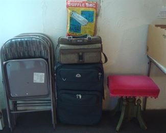 Lower Level:  Folding chairs (set of 4) are always handy, as is luggage.  The bright rose velvet covered stool is vintage.