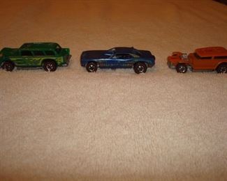 SMALLS Area-CASE:  Three 1969 HOT WHEELS cars with red line tires.