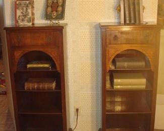 Lower Level:  Two separately priced vintage bookcases each has one upper drawer and four shelves.  Each one measures 20" wide x 13-l/2" deep x 50" tall.  The vintage books are also individually priced.  