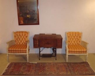 Lower Level:  Two individually priced striped/tufted arm chairs with cane sides flank an antique ROTARY sewing machine (closer photo follows); the runner and mirror are also for sale.