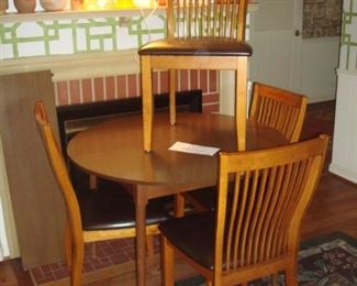 Family Room:  We moved these items from the kitchen to the family room so we could make room for all of the kitchenware to be displayed in the kitchen.  The table (42" round and one 12" leaf) is priced separately from the four chairs which have deep chocolate brown vinyl seats.
