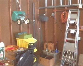 Garage:  A folding wheel chair; yellow stackable bins; and ladders are also for sale.