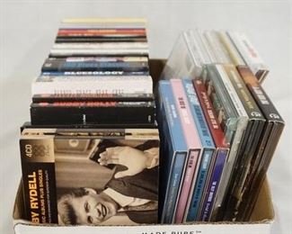 1193	LOT OF CDS VARIOUS BANDS/ARTISTS, MANY OF WHICH ARE CD SETS INCLUDING; BOBBY RYDELL (4 CD SET) TRAFFIC (5 CD SET) DINAH WASHINGTON (5 CD SET) BLOSSOM DEARIE COMPLETE RECORDINGS (4 CD SET) HOWLIN' WOLF (3 CD SET) LEADBELLY (3 CD SET) BUDDY HOLLY & THE CRICKETS (3 CD SET) THE VERY BEST OF BLUEGRASS (3 CDSET) CHUCK BERRY (3 CD SET) THE SHADOWS (3 CD SET) BLUESOLOGY (3 CD SET) 100 BLUES CLASSICS (4 CD SET) AND MANY MORE!
