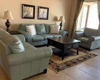 Ashley Leather Sofa, Loveseat and 2 Arm Chairs, Coffee Table w 4 Drawers and 4 Pullouts, End Tables pr, Table Lamps, pr, Area Rug, Art pair, Decorative Pillows pr