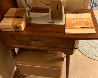 Singer sewing machine & stool.  All attachments & miscellaneous sewing items. included