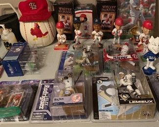 Small part of Cardinal Memorabilia including  a Lou Brock Bobble head.  Action sports players in original boxes (Dale Ehrhart and some Starwars)  We also have Blue's memorabilia.