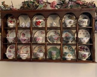 Lovely display wall unit with 18 cup and saucer sets.  This is a wonderful collection l
