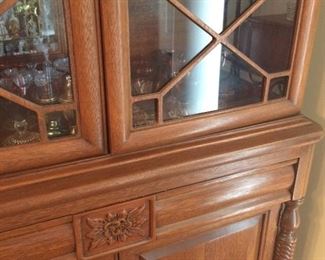 Same emblem and scrolled posts and feet as the sideboard/buffet!