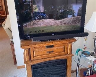 Sony Bravia tv and soundbar, gas fireplace wall unit