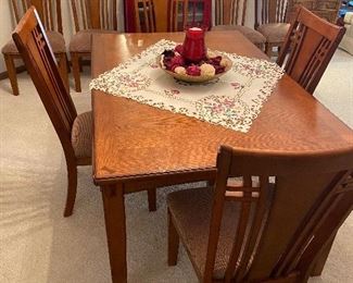Dining room table with 8 chairs and leaf