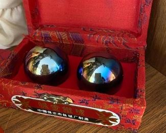 Oriental metal stress/massage balls in red case