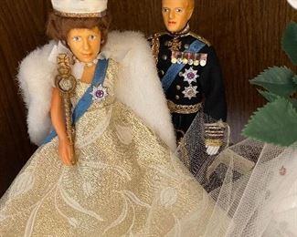 Queen Elizabeth II and Prince Charles(???) figurines