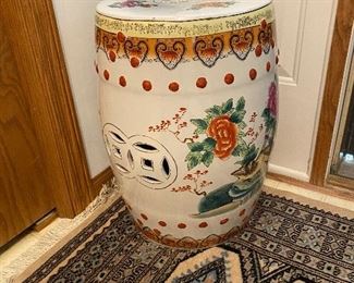 Entry rug and tall porcelain container