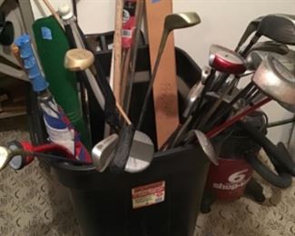 Golf clubs and umbrellas