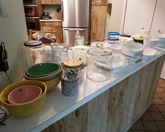 Antique pottery bowls, Pyrex bakeware, flatware,  and pantry of food!