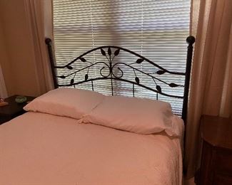 Full bed with metal headboard