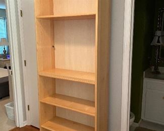 Tall bookcase.  shelf is there, but missing a support