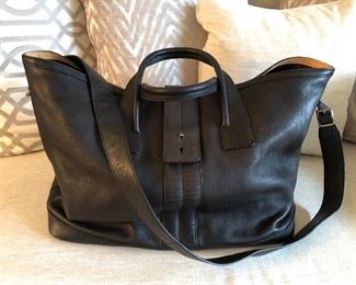 TOD's black leather duffel / top handle tote with tan interior accents