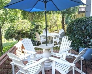Set/4 white wooden Adirondack armchairs, with faux concrete umbrella stand and nice blue umbrella.