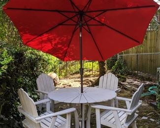 Set/4 white wood armchairs, with matching table and red umbrella.