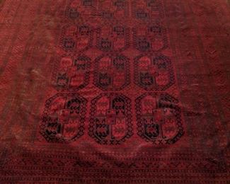 Room size vintage hand-woven Pakistani Bokhara rug, measures 13' 6" x 9'.