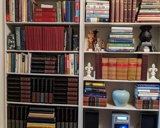 Lots of reference books, encyclopedia sets, assorted collectibles and a vintage Brookstone AcoustiClear 3-CD - vertical CD player.