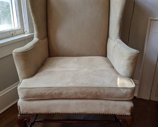 The second pigskin upholstered wingback chair.