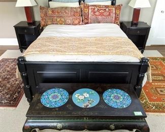 Wonderfully comfortable queen size black wood bed, with headboard/footboard, relatively new pillow-top mattress set, with Ralph Lauren foot warmer and Persian rug remnant pillows, pair of matching bedside tables and amazing Asian cloisonne and lacquered table.