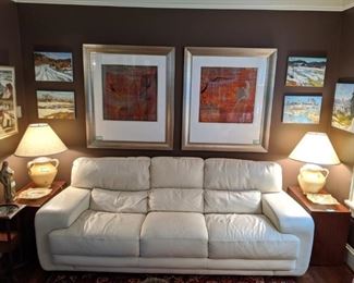 Wonderfully MCM/contemporary style Italian white leather sofa, by Sofitalia, with pair of vintage MCM walnut side table, by Dillingham's Furniture Co., of Sheboygan, WI (est. 1857) pair of butter yellow Grecian urn style table lamps and wall of original artwork, by Russian artists.