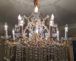 All well-lit by the 13-light Maria Theresa Italian crystal chandelier.