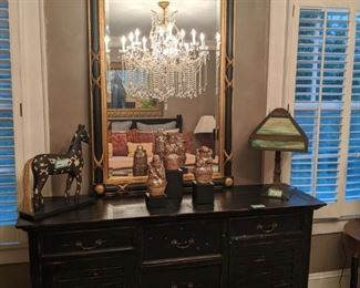 Contemporary 5-drawer, 2-door dresser, matching the queen size bed and bedside table, vintage slag glass table lamp, vintage LaBarge empire style wall mirror and Appaloosa taxidermied pony.