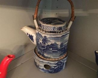 Blue and white teapot on ceramic burner