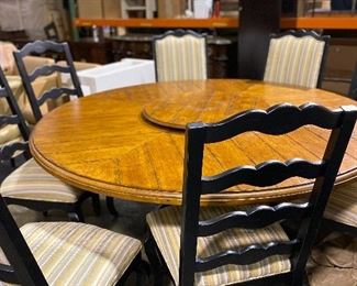 Round pedestal table with seating for 8