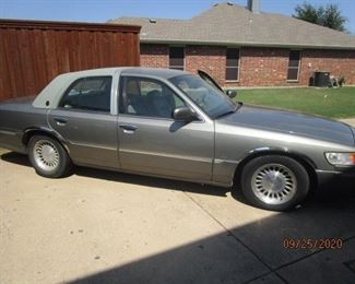 2000 Mercury Grand Marquis, 91k miles.  New battery, interior has soft leather seats and is in excellent condition.  