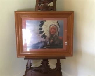 Beautiful carved wood stand with glass and wood framed picture
