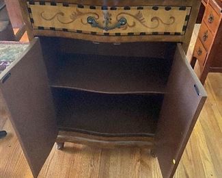 Storage area of Cabinet with scroll work - black top 