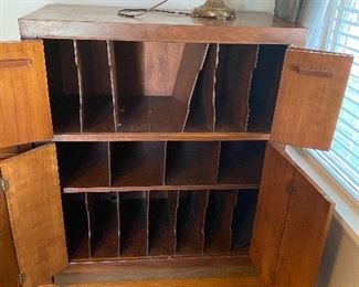 Music cabinet with doors open in both levels. 