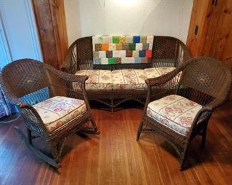 Three piece wicker set with replaced cushions