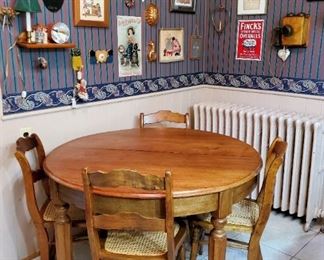 Round oak table with four chairs