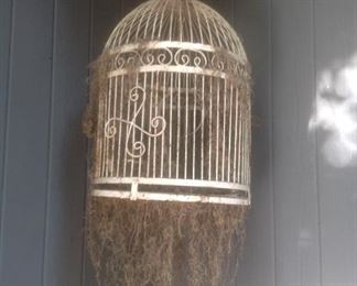 This white bird cage is 23" tall and 16" wide.  Presale $22.