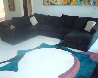 Arhaus sectional sofa and carpeting.