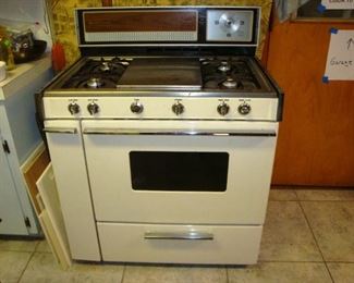 Magic Chef gas stove and oven with griddle.