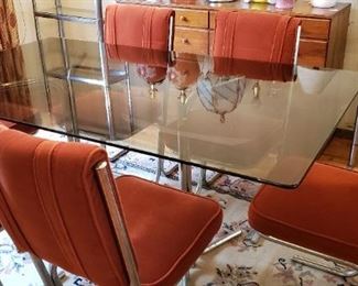 Retro early 1980's dinning table with 6 chairs.  $200 for entire set.