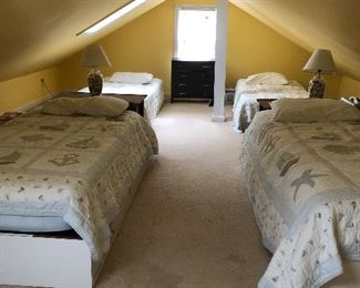 4 twin beds, 2 with drawer storage underneath, 2 with box springs. 