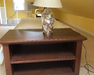 2 tables with shelves, 30” wide, 18” deep, 24” high.   2 lamps filled with shells. 