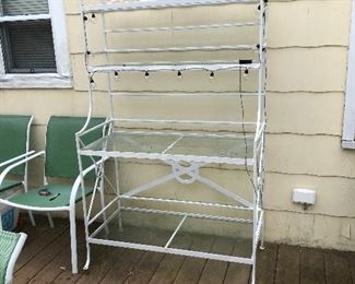 Outdoor metal and glass bakers rack.42” wide, 19” deep, 70 1/2” high. 